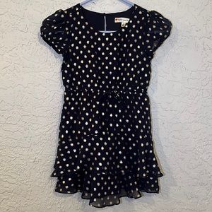 Adorable little girls dress in navy with gold polka dots.